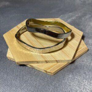 Two Silver Bangles Stamped Taxco Mexico. One hammered, one plain, clasp closures